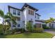 Beautiful two-story home with manicured lawn, a well-kept yard, and a welcoming curb appeal at 4861 Antrim Dr, Sarasota, FL 34240