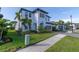 Charming two-story home with lush landscaping and a well-manicured lawn creates a welcoming exterior at 4861 Antrim Dr, Sarasota, FL 34240