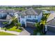 Two story home with a brick driveway, two car garage, and well-manicured landscaping at 4861 Antrim Dr, Sarasota, FL 34240