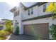 Exterior of a two-story home with a brick driveway and well-maintained landscaping at 4861 Antrim Dr, Sarasota, FL 34240