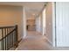 Hallway with neutral carpet and white trim, leading to other rooms at 4861 Antrim Dr, Sarasota, FL 34240