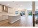 Stylish kitchen featuring white cabinets, stainless steel appliances, and views of the pool area at 4861 Antrim Dr, Sarasota, FL 34240