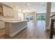 Bright kitchen with a center island, pendant lights, and open access to the screened pool area at 4861 Antrim Dr, Sarasota, FL 34240