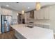 Contemporary kitchen with stainless steel appliances, white cabinets, and a large island at 4861 Antrim Dr, Sarasota, FL 34240
