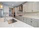 Modern kitchen features white cabinetry, stainless steel appliances, and quartz countertops at 4861 Antrim Dr, Sarasota, FL 34240