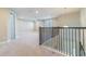 Bright loft area featuring neutral carpet, ceiling fan, and plenty of natural light from windows at 4861 Antrim Dr, Sarasota, FL 34240