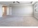 Expansive main bedroom featuring neutral carpet, an ensuite, and natural light from windows at 4861 Antrim Dr, Sarasota, FL 34240