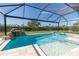 Sparkling screened pool with a spa and rock waterfall promises endless summer fun at 4861 Antrim Dr, Sarasota, FL 34240