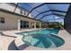 Luxurious screened pool area with a spa offers a private retreat for relaxation and entertainment at 4861 Antrim Dr, Sarasota, FL 34240