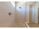 Close up of a shower featuring stone pebble floor and bright natural light at 4861 Antrim Dr, Sarasota, FL 34240