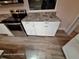 Stylish kitchen cabinets complement granite countertops and a stainless steel oven in this inviting kitchen at 6505 Oelsner St, New Port Richey, FL 34652