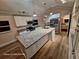 Bright, remodeled kitchen with granite countertops, stainless steel appliances, and a central island, perfect for cooking at 6505 Oelsner St, New Port Richey, FL 34652