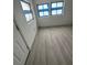 This simple bedroom has new vinyl flooring, is freshly painted and offers a spacious and simple design at 8612 N Alaska St, Tampa, FL 33604