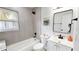 Clean bathroom featuring modern vanity, updated tile surround, new fixtures and a window at 2456 S 17Th S Ave, St Petersburg, FL 33712