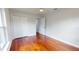 Cozy bedroom featuring hardwood floors, a closet, and a window allowing for natural light at 2456 S 17Th S Ave, St Petersburg, FL 33712