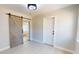 Entryway featuring barn door and white ceramic tile flooring at 2456 S 17Th S Ave, St Petersburg, FL 33712