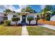 Charming home with a white exterior, manicured landscaping, and a welcoming front porch with decorative wreath at 2456 S 17Th S Ave, St Petersburg, FL 33712