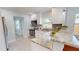 Updated kitchen with white cabinets, stainless steel appliances, and granite countertops at 2456 S 17Th S Ave, St Petersburg, FL 33712
