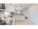 Open concept kitchen offering stainless appliances and stone countertops at 2456 S 17Th S Ave, St Petersburg, FL 33712