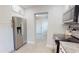 Stainless steel refrigerator and appliances in a modern kitchen with white cabinets at 2456 S 17Th S Ave, St Petersburg, FL 33712