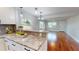Open-concept kitchen flows into the dining area featuring granite counters and modern finishes at 2456 S 17Th S Ave, St Petersburg, FL 33712
