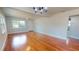 Open-concept living space with hardwood floors and abundant natural light from the many windows at 2456 S 17Th S Ave, St Petersburg, FL 33712