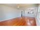 Bright living area featuring hardwood floors, a ceiling fan, and seamlessly connects to the dining area at 2456 S 17Th S Ave, St Petersburg, FL 33712