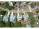Aerial view of a neighborhood featuring well-maintained homes, green lawns, and inviting backyard pools at 7337 Cone Shell Dr, Spring Hill, FL 34607