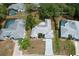 Aerial view of the home showing the roof, driveway, and surrounding area at 7337 Cone Shell Dr, Spring Hill, FL 34607