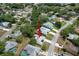 Clear aerial view of a home nestled among trees, showing its location in the established neighborhood at 7337 Cone Shell Dr, Spring Hill, FL 34607