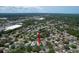 Aerial view of home in a treed neighborhood at 7337 Cone Shell Dr, Spring Hill, FL 34607