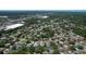 Expansive aerial view of a residential neighborhood with tree-lined streets and varied home styles at 7337 Cone Shell Dr, Spring Hill, FL 34607