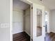 Walk-in closet featuring wire shelving for ample storage and a mirrored door to the bathroom at 7337 Cone Shell Dr, Spring Hill, FL 34607
