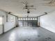 Spacious garage with a ceiling fan and an automatic door opener at 7337 Cone Shell Dr, Spring Hill, FL 34607