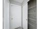 Hallway featuring doors to storage and other rooms in the house at 7337 Cone Shell Dr, Spring Hill, FL 34607