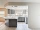 Bright kitchen with gray cabinets and white countertops at 7337 Cone Shell Dr, Spring Hill, FL 34607