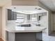 Kitchen featuring gray cabinets, white countertops, and a skylight at 7337 Cone Shell Dr, Spring Hill, FL 34607