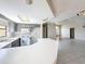 Kitchen with breakfast bar overlooking the open living area at 7337 Cone Shell Dr, Spring Hill, FL 34607