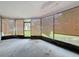 Enclosed patio space with bamboo blinds, overlooking backyard at 7337 Cone Shell Dr, Spring Hill, FL 34607
