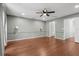 Spacious bedroom featuring hardwood floors, ceiling fan and neutral paint at 2731 Penzance St, Palm Harbor, FL 34684