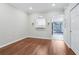 Spacious bonus room with wood floors, wet bar, and access to an outdoor area at 2731 Penzance St, Palm Harbor, FL 34684