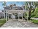 Two story home with a covered parking area and well manicured landscaping at 2731 Penzance St, Palm Harbor, FL 34684