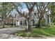 Two-story blue home with a charming covered parking area at 2731 Penzance St, Palm Harbor, FL 34684