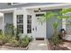 Inviting front entrance with beautiful landscaping at 2731 Penzance St, Palm Harbor, FL 34684