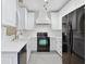 Bright kitchen featuring white cabinets and stainless steel appliances at 2731 Penzance St, Palm Harbor, FL 34684