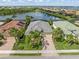 A well maintained property with lush landscaping is seen from above in this aerial view highlighting the home's great location at 13064 N Marsh Dr, Port Charlotte, FL 33953