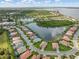 Expansive aerial view of a residential community with lush landscaping, serene lakes, and beautiful homes at 13064 N Marsh Dr, Port Charlotte, FL 33953