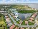 A home in a lakeside community is pinpointed in this aerial shot showcasing the property's prime location and serene surroundings at 13064 N Marsh Dr, Port Charlotte, FL 33953
