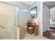 Bathroom featuring large glass shower, neutral tile, and seating at 13064 N Marsh Dr, Port Charlotte, FL 33953