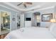 Spacious main bedroom with hardwood floors, ensuite bath access, and backyard views at 13064 N Marsh Dr, Port Charlotte, FL 33953